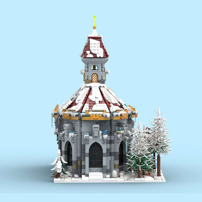 snow covered cathedral building blocks model with clock tower christmas decor
